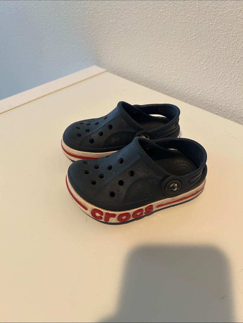 CROCS Kids Navy Blue Clogs with White and Red Trim